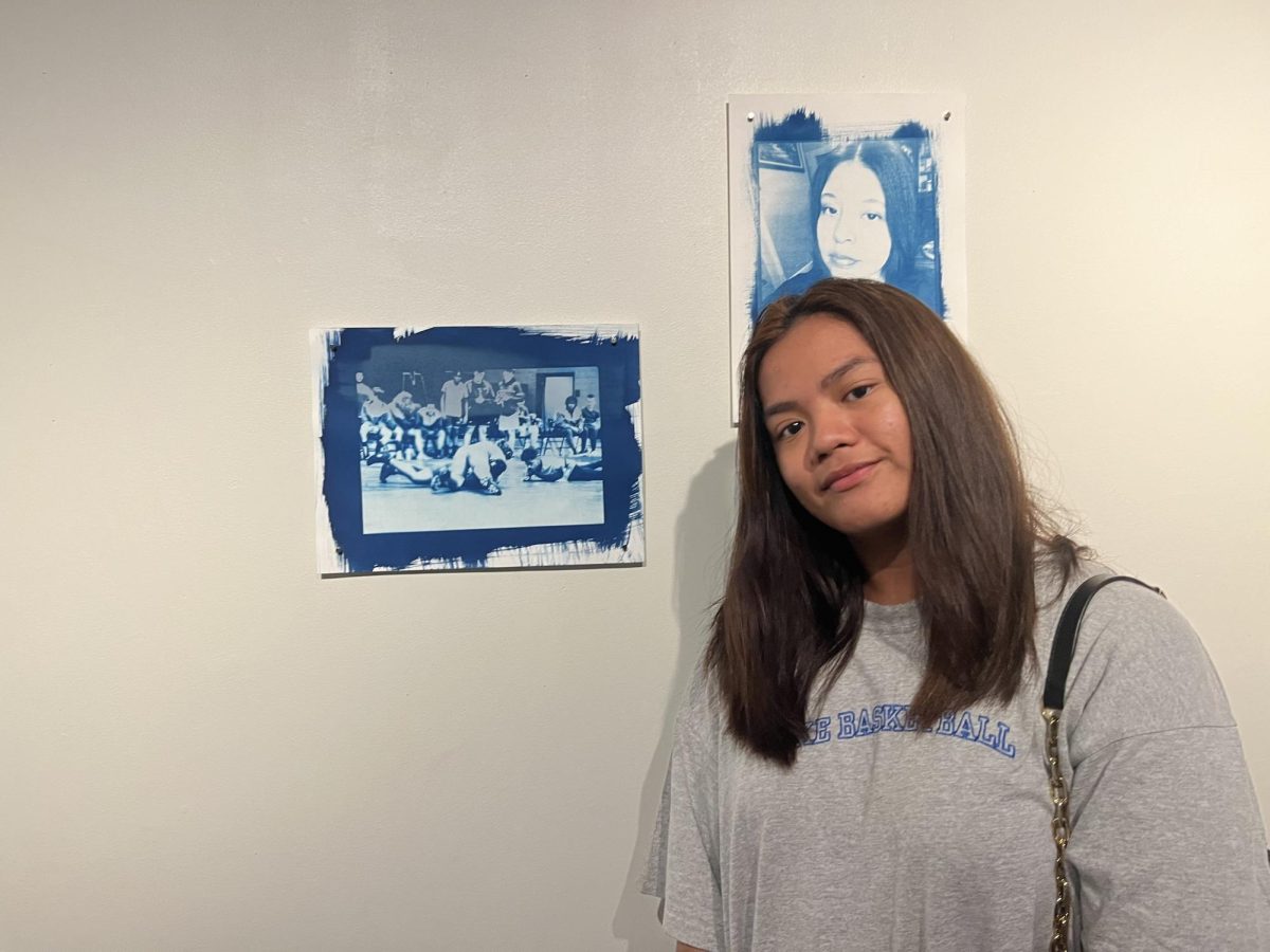 High school student Chryscis Gindhart made a self-portrait involving wrestling for a summer AACC class for dual-enrolled bilingual students.