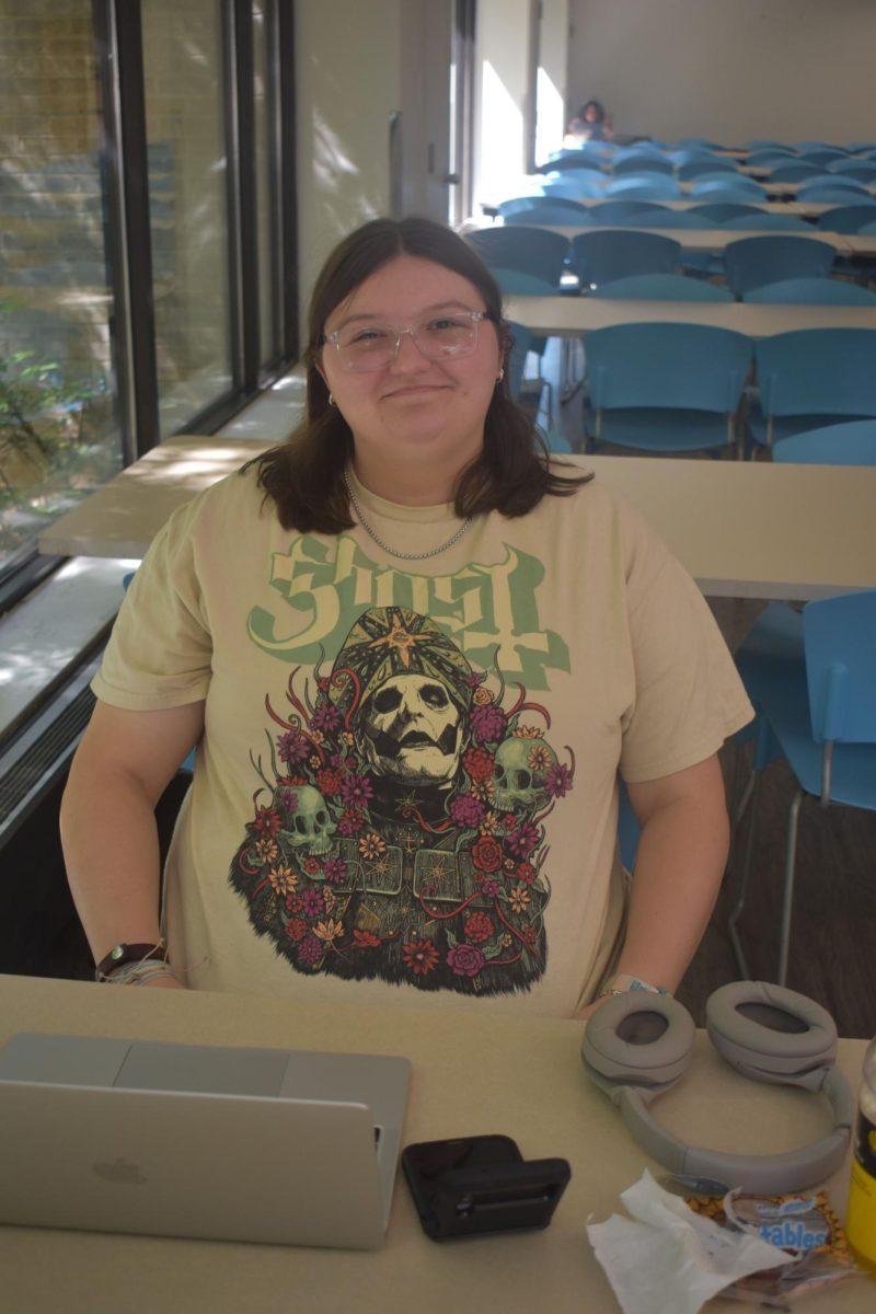 Second-year graphic design student Alyssa Fox wears a T-shirt showing off a favorite band, Ghost.