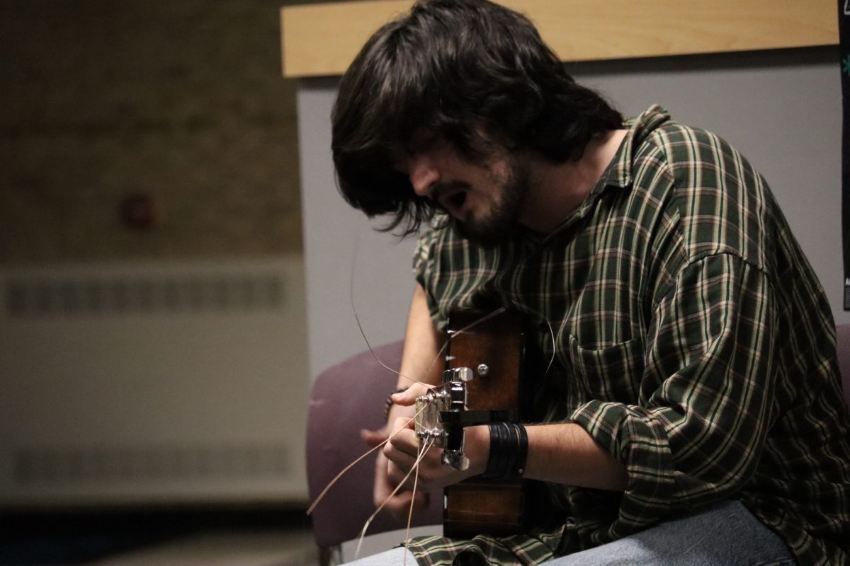 Students perform songs and poetry at the Amaranth Coffee House every month. Shown, third-year film student Jason Kalshoven. 