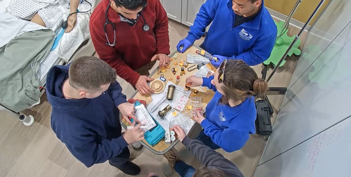 Paramedic students receive hands-on learning experience by identifying medical hazards and looking for clues in an escape room-style classroom.