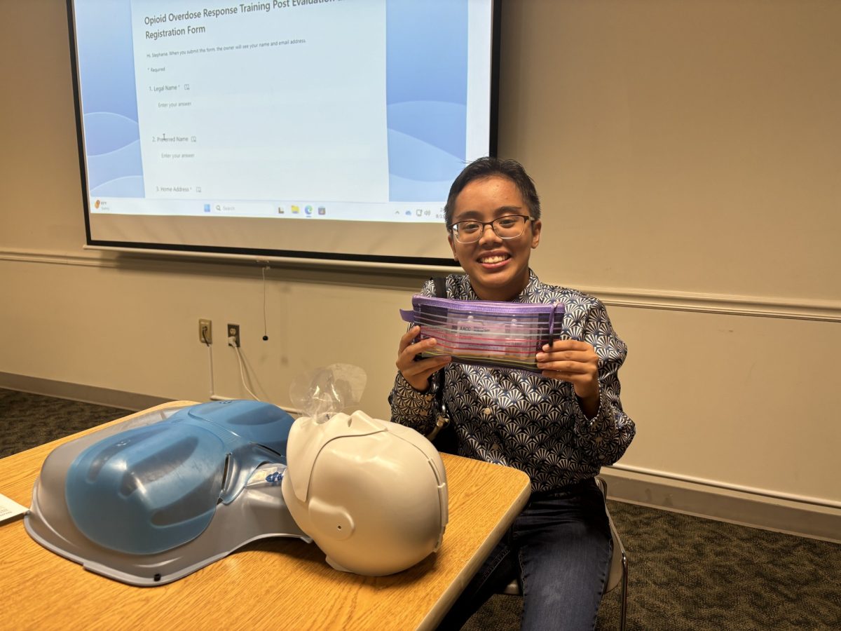 Students and staff earn certificates to administer a nasal spray that can reverse a drug overdose. Shown, English language learner program student worker Reymark Catot.