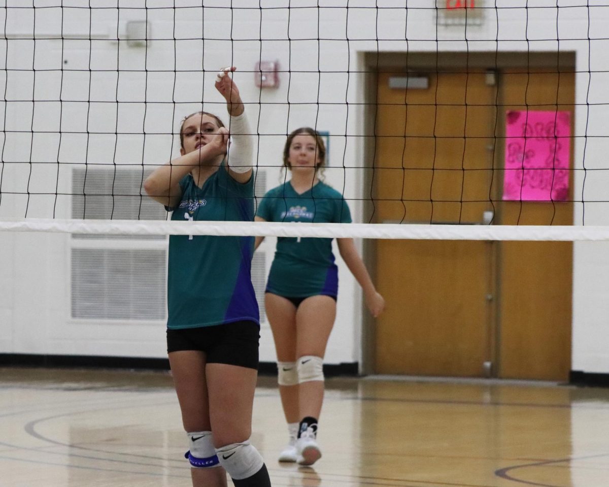 Outside hitter Jadyn Brown (front) and setter Bella Hadden practice for the season’s final games. 