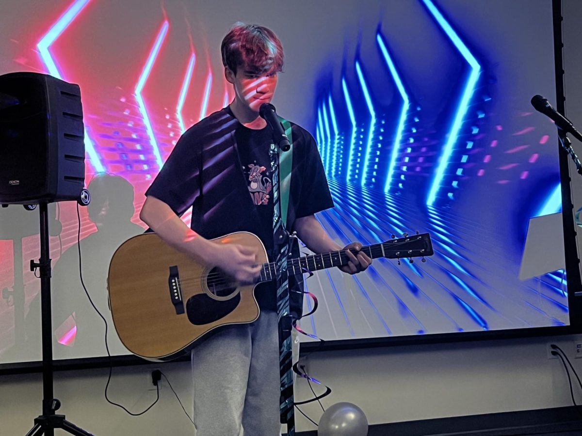 Students participate in a karaoke event for  Welcome Week. Shown, first-year social work student Henry Ledford. 