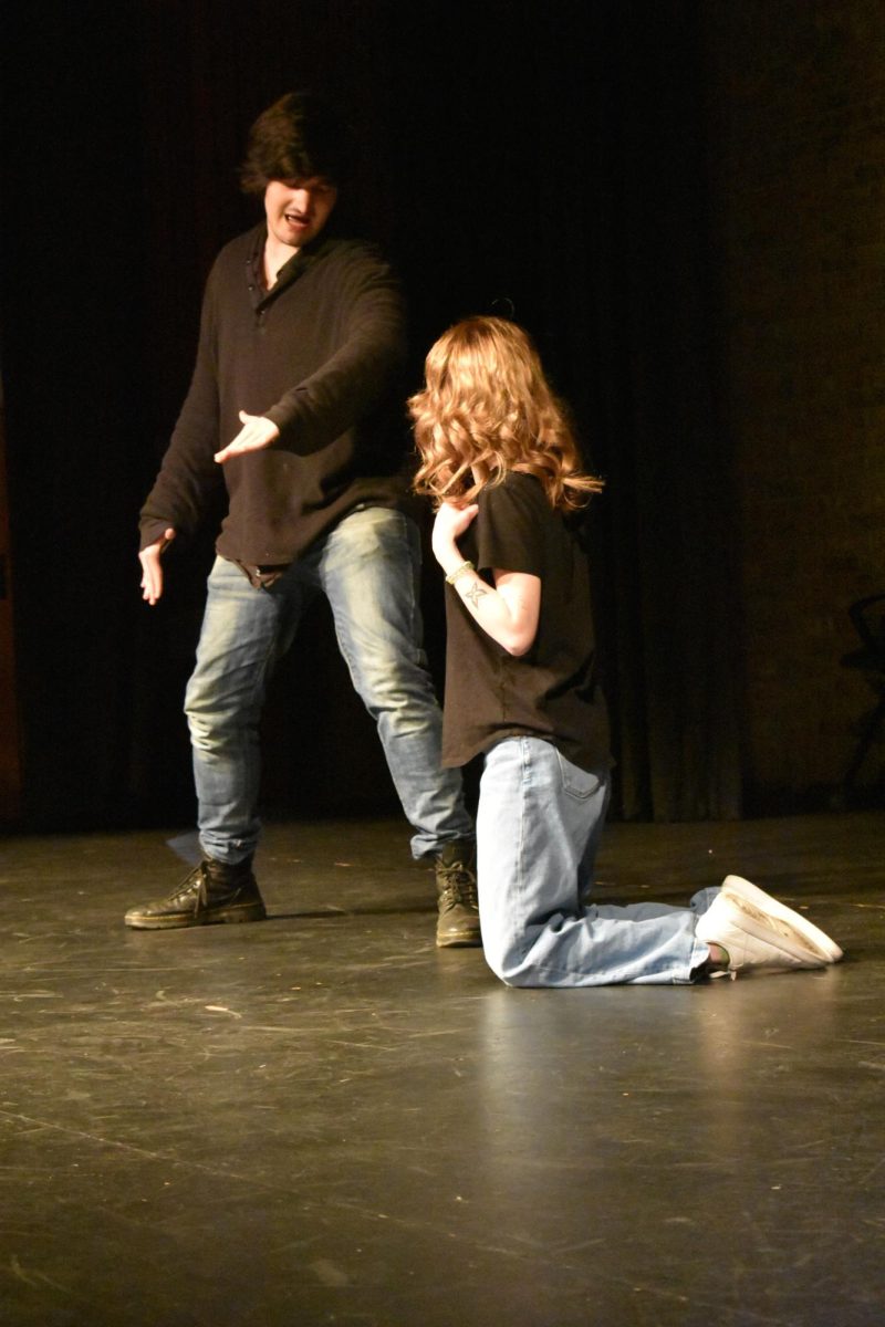 Overcast Improv Vice President Jason Kalshoven, left, and student Cameron Millar perform at Overcast Improv’s December show.