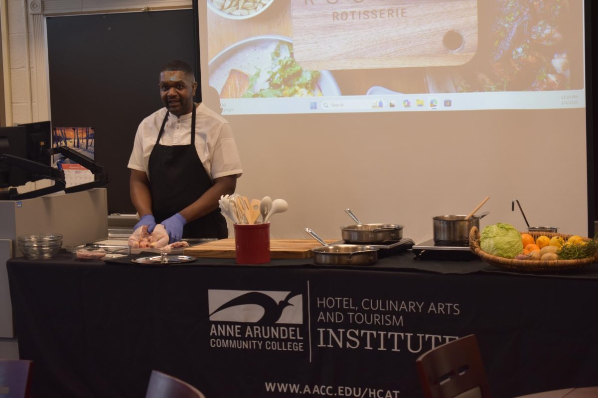 Chef Joseph Burton and The Hotel Culinary Arts & Tourism Institute collaborated to show students how to make food, like herb roasted potatoes, for a Black History Month event. 